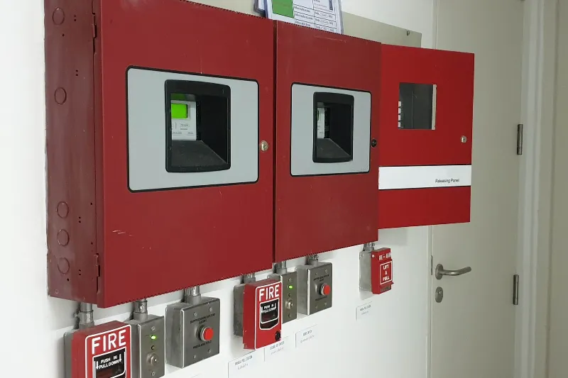Fire alarm system with red control panels.